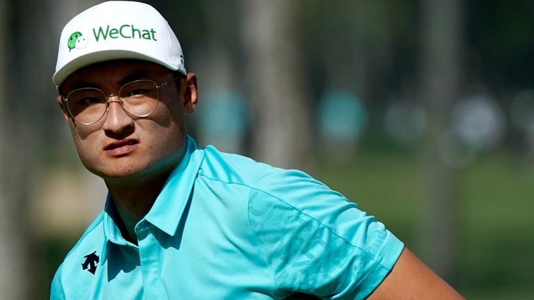 Haotong Li, of China, watches his birdie putt miss the cup on the ninth green during the second round of the Sony Open golf tournament, Friday, Jan. 14, 2022, at Waialae Country Club in Honolulu. (AP Photo/Matt York)..
