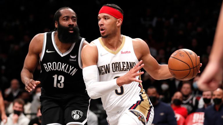 New Orleans Pelicans guard Josh Hart drives to the basket against Brooklyn Nets guard James Harden during the second half of an NBA basketball game, Saturday, Jan. 15, 2022, in New York. 