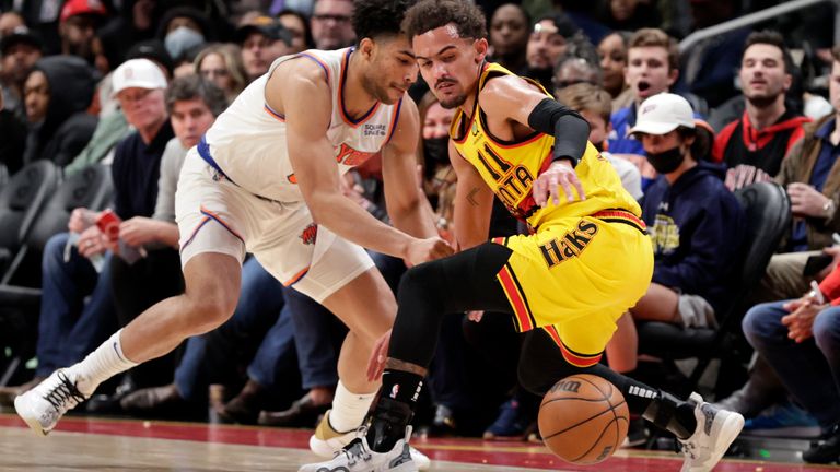 Atlanta Hawks guard Trae Young looses control of the ball as New York Knicks guard Quentin Grimes defends during the second half of an NBA basketball game Saturday, Jan. 15, 2022, in Atlanta.