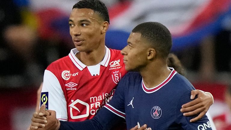 Reims&#39; Hugo Ekitike pictured with PSG&#39;s Kylian Mbappe (AP)