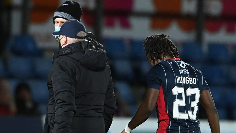 DINGWALL, SCOTLAND - JANUARY 18: Ross County's Joseph Hungbo goes off injured during a Cinch Premiership match between Ross County and Motherwell at the Global Energy Stadium, on January 18, 2022, in Dingwall, Scotland. (Photo by Paul Devlin / SNS Group)