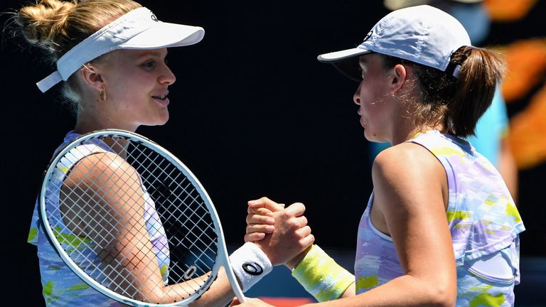Poland's Iga Swiatek (R) celebrates after victory against Britain's Harriet Dart during their women's singles match on day two of the Australian Open tennis tournament in Melbourne on January 18, 2022