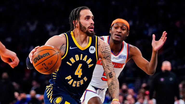 Indiana Pacers&#39; Duane Washington Jr. (4) drives past New York Knicks&#39; Immanuel Quickley (5) during the first half of an NBA basketball game Tuesday, Jan. 4, 2022, in New York. (AP Photo/Frank Franklin II)