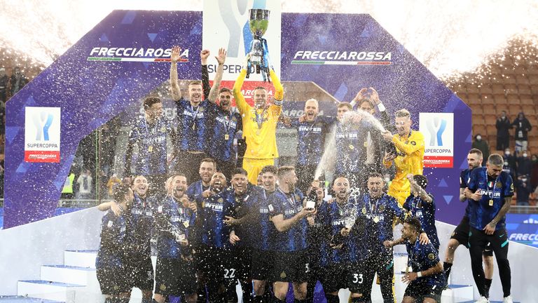 Inter Milan's players celebrate with the Italian Super Cup