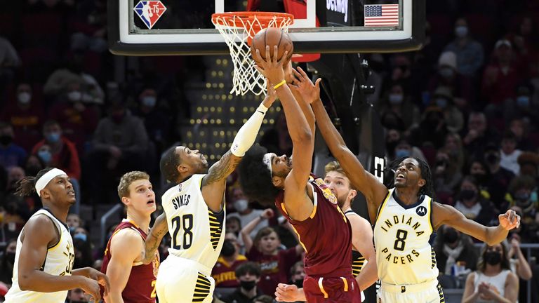 Cleveland Cavaliers&#39; Jarrett Allen rebounds a shot against Indiana Pacers&#39; Keifer Sykes and Justin Holiday