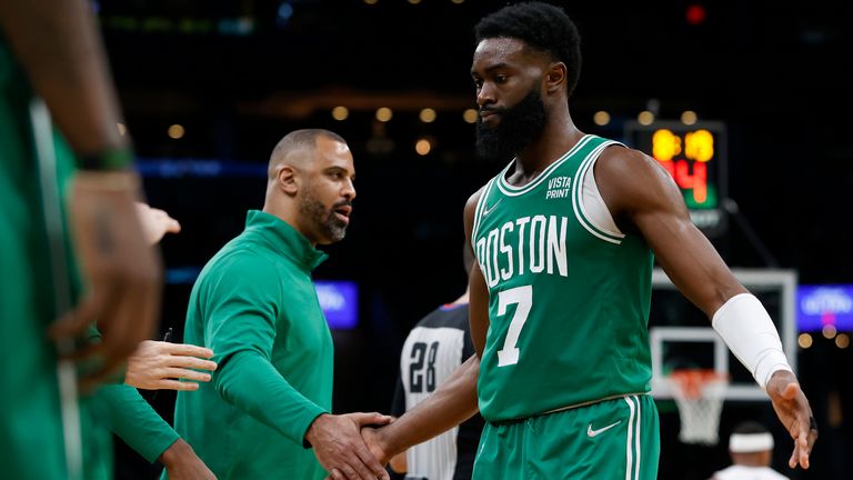 Boston Celtics guard Jaylen Brown is congratulated by coach Ime Udoka during the second half of an NBA basketball game against the Orlando Magic