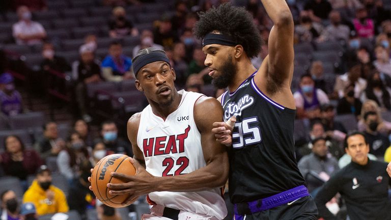 Miami Heat forward Jimmy Butler drives past Sacramento Kings forward Marvin Bagley III