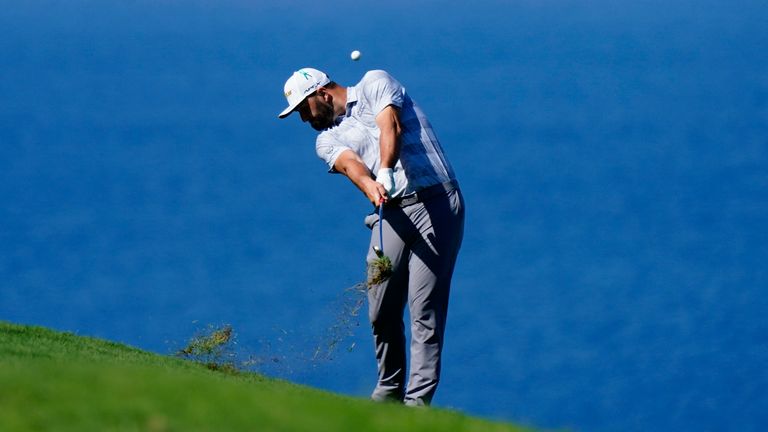 Jon Rahm of Spain hits from the fairway on the fourth hole during the first round of the Tournament of Champions golf event, Thursday, Jan. 6, 2022, at Kapalua Plantation Course in Kapalua, Hawaii. (AP Photo/Matt York)