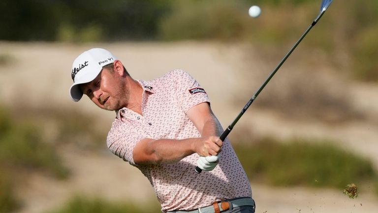 Justin Harding of South Africa plays a shot on the 14th fairway during third round of the Dubai Desert Classic golf tournament in Dubai, United Arab Emirates, Saturday, Jan. 29, 2022. (AP Photo/Kamran Jebreili)