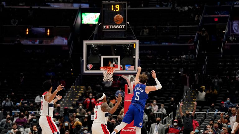 Los Angeles Clippers guard Luke Kennard hits the game tying shot during the second half of an NBA basketball game against the Washington Wizards