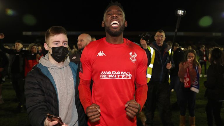 Fans celebrate with Kidderminster Harriers' Amari Morgan-Smith after the FA Cup Third Round victory over Reading