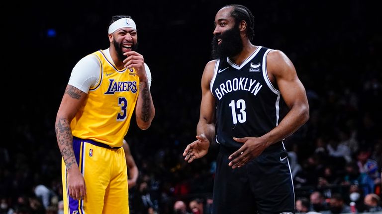 Los Angeles Lakers&#39; Anthony Davis laughs with Brooklyn Nets&#39; James Harden