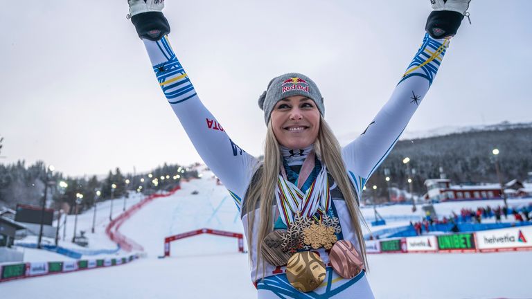 Vonn posing in February 2019 with her medals after her final competitive race in Sweden