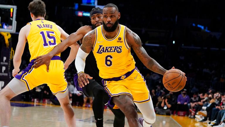 Los Angeles Lakers forward LeBron James (6) dribbles during the first half of an NBA basketball game against the Sacramento Kings Tuesday, Jan. 4, 2022, in Los Angeles. (AP Photo/Marcio Jose Sanchez)