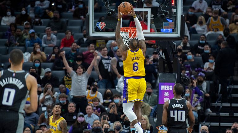 Los Angeles Lakers forward LeBron James dunks a ball for a basket 