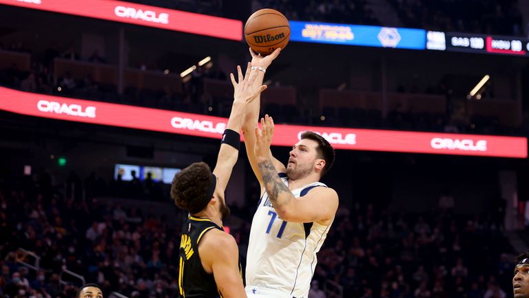 Dallas Mavericks guard Luka Doncic shoots against Golden State Warriors guard Klay Thompson