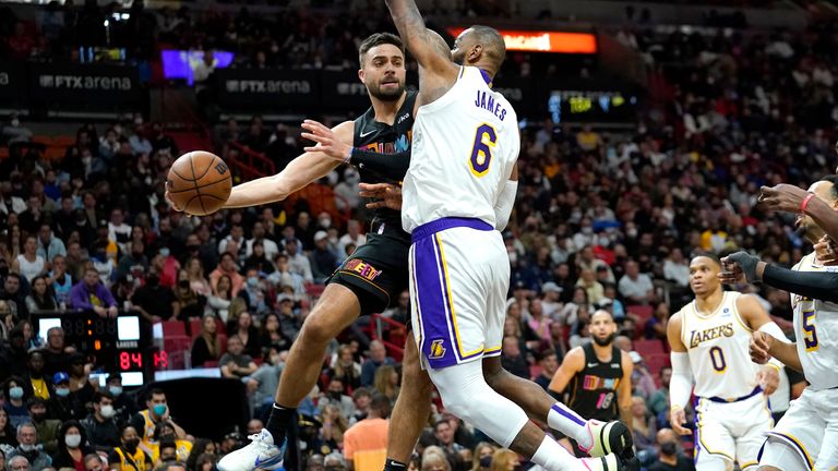 Miami Heat guard Max Strus passes the ball as Los Angeles Lakers forward LeBron James 