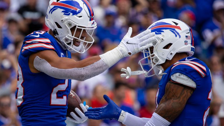 Buffalo Bills strong safety Micah Hyde (23) celebrates his interception with free safety Jordan Poyer (21) during the third quarter of an NFL football game against the Washington Football Team, Sunday, Sept. 26, 2021, in Orchard Park, N.Y. (AP Photo/Brett Carlsen)