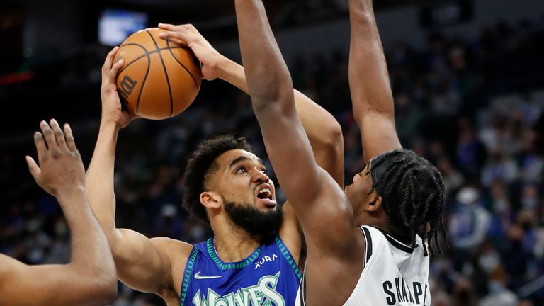 Minnesota Timberwolves center Karl-Anthony Towns goes to the basket against Brooklyn Nets center Day&#39;Ron Sharpe 