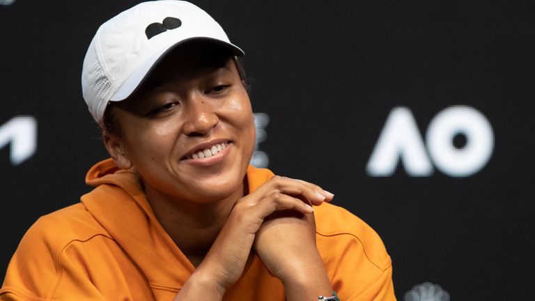 Japan's Naomi Osaka smiles during a press conference ahead of the Australian Open tennis championships in Melbourne, Australia, Saturday, Jan. 15, 2022. (AP Photo/Simon Baker)