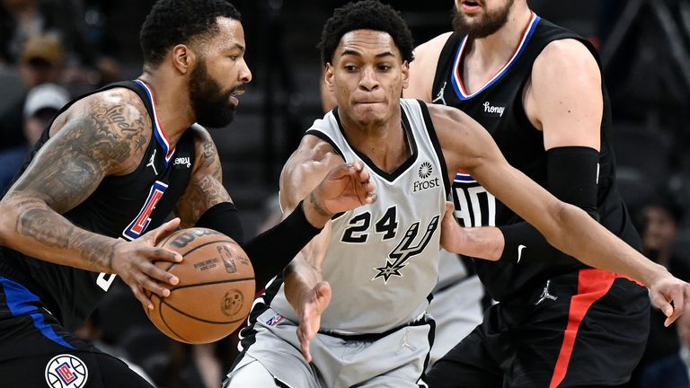 Los Angeles Clippers&#39; Marcus Morris, Sr., drives against San Antonio Spurs&#39; Devin Vassell during the first half of an NBA basketball game, Saturday, Jan. 15, 2022, in San Antonio