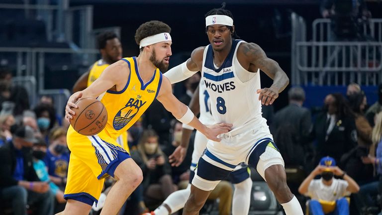Golden State Warriors guard Klay Thompson drives to the basket against Minnesota Timberwolves forward Jarred Vanderbilt during the first half of an NBA basketball game in San Francisco, Thursday, Jan. 27, 2022. 