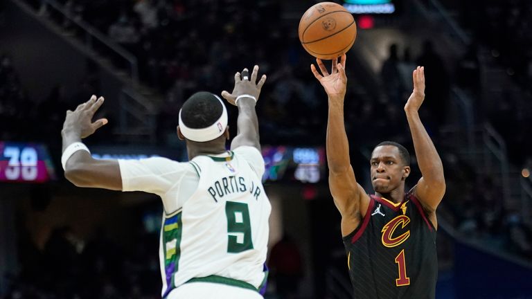 Cleveland Cavaliers&#39; Rajon Rondo (1) shoots over Milwaukee Bucks&#39; Bobby Portis (9) in the second half of an NBA basketball game, Wednesday, Jan. 26, 2022, in Cleveland. (AP Photo/Tony Dejak)