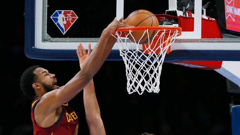 Cleveland Cavaliers forward Evan Mobley dives over Oklahoma City Thunder forward Jeremiah Robinson-Earl during the second half of an NBA basketball game Saturday, January 15, 2022 in Oklahoma City.