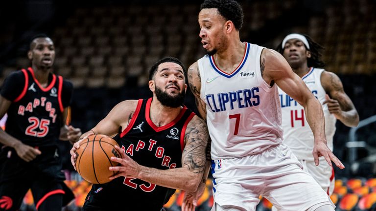 Toronto Raptors guard Fred VanVleet (23) is defended by Los Angeles Clippers guard Amir Coffey (7) during the second half of an NBA basketball game on Saturday, December 31, 2021 in Toronto.