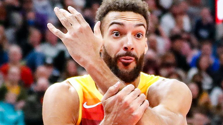 Utah Jazz center Rudy Gobert (27) complains about being held during the first half of an NBA basketball game Friday, Dec. 31, 2021, in Salt Lake City.