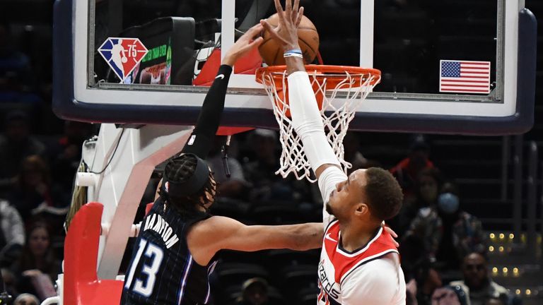 R.J. Hampton #13 of the Orlando Magic dunks the ball over Daniel Gafford #21 of the Washington Wizards in the second quarter during a NBA basketball game at the Capital One Arena on January 12, 2022 in Washington, DC. 