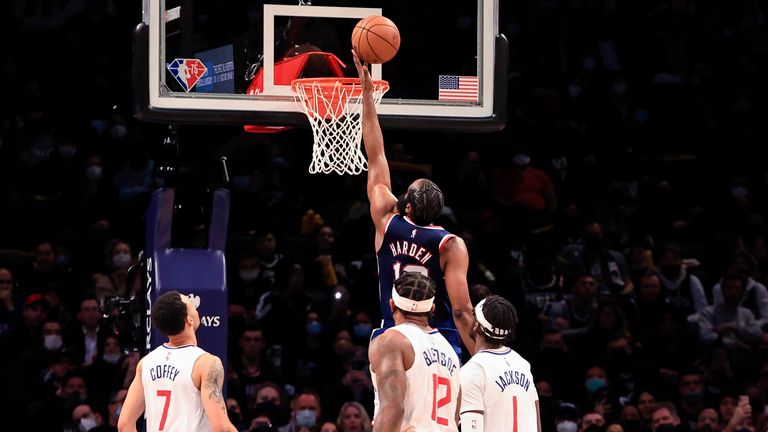 Brooklyn Nets guard James Harden (13) drives to the basket against the Los Angeles Clippers during the second half of an NBA basketball game Saturday, Jan. 1, 2022, in New York.