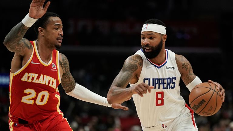 Los Angeles Clippers&#39; Marcus Morris Sr., right, drives past Atlanta Hawks&#39; John Collins during second half of an NBA basketball game Sunday, Jan. 9, 2022, in Los Angeles. (AP Photo/Jae C. Hong)


