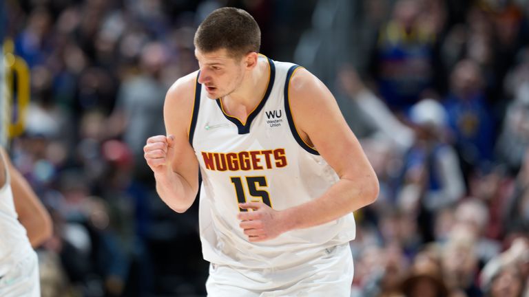 Denver Nuggets center Nikola Jokic reacts after hitting a three-point-basket in the second half of an NBA basketball game against the Utah Jazz
