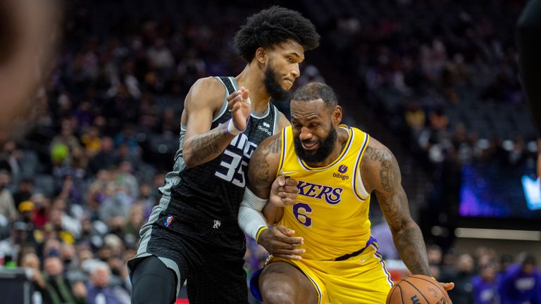 Sacramento Kings forward Marvin Bagley III (35) defends Los Angeles Lakers forward LeBron James (6) in the first quarter of an NBA basketball game in Sacramento, Calif., Wednesday, Jan. 12, 2022.