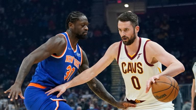 Cleveland Cavaliers&#39; Kevin Love (0) drives against New York Knicks&#39; Julius Randle (30) in the first half of an NBA basketball game, Monday, Jan. 24, 2022, in Cleveland. (AP Photo/Tony Dejak)


