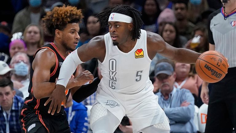 Oklahoma City Thunder forward Luguentz Dort (5) works gainst New York Knicks guard Miles McBride during the first half of an NBA basketball game Friday, Dec. 31, 2021, in Oklahoma City.