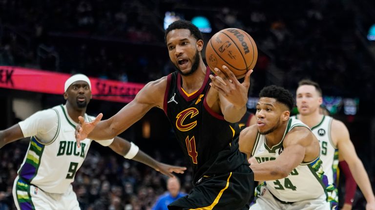 Cleveland Cavaliers&#39; Evan Mobley (4) drives against the Milwaukee Bucks in the second half of an NBA basketball game, Wednesday, Jan. 26, 2022, in Cleveland. (AP Photo/Tony Dejak)