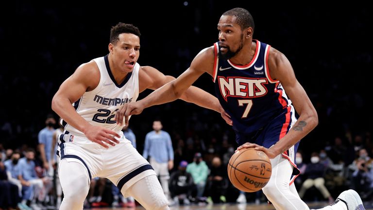 Brooklyn Nets striker Kevin Durant (7) drives past Memphis Grizzlies guard Desmond Bane (22) during the second half of an NBA basketball game on Monday, January 3, 2022 in New York.