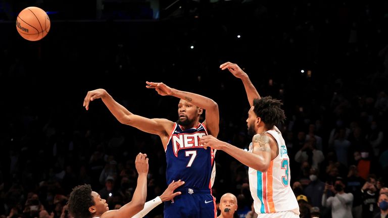 Brooklyn Nets forward Kevin Durant (7) makes the game winning assist to Brooklyn Nets guard Cam Thomas (24) against the San Antonio Spurs during overtime of an NBA basketball game, Sunday, Jan. 9, 2022, in New York. (AP Photo/Jessie Alcheh)


