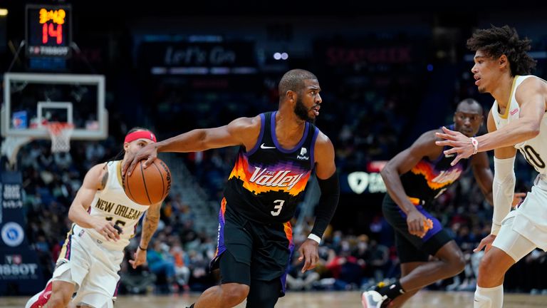 Phoenix Suns guard Chris Paul (3) drives to the basket against New Orleans Pelicans center Jaxson Hayes in the second half of an NBA basketball game in New Orleans, Tuesday, Jan. 4, 2022. The Suns won 123-110.