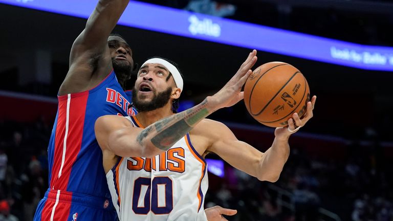 Phoenix Suns center JaVale McGee (00) is defended by Detroit Pistons center Isaiah Stewart during the second half of an NBA basketball game, Sunday, Jan. 16, 2022, in Detroit