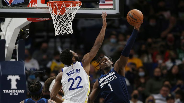 Minnesota Timberwolves forward Anthony Edwards (1) shoots the ball against Golden State Warriors forward Andrew Wiggins (22) during the second half of an NBA basketball game