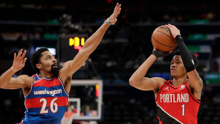 Portland Trail Blazers&#39; Anfernee Simons shoots as Washington Wizards&#39; Spencer Dinwiddie defends during the second half of an NBA basketball game, Saturday, Jan. 15, 2022, in Washington.