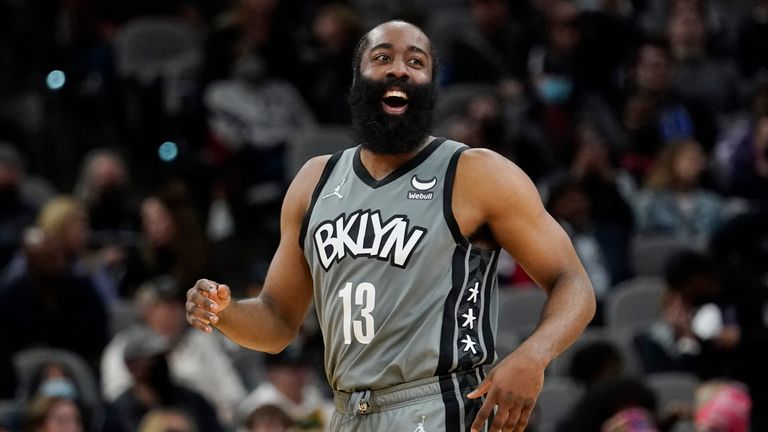 Brooklyn Nets guard James Harden smiles after scoring against the San Antonio Spurs. 