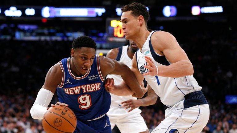 New York Knicks guard RJ Barrett drives to the basket against Dallas Mavericks center Dwight Powell.
                                                       