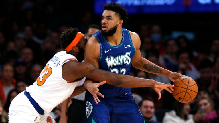 New York Knicks center Mitchell Robinson defend against Minnesota Timberwolves center Karl-Anthony Towns 