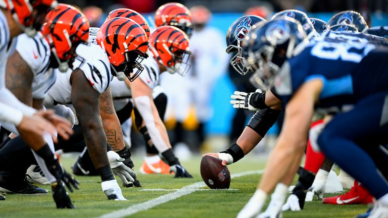 The Tennessee Titans play the Cincinnati Bengals at the line of scrimmage during the first half of an NFL divisional round playoff football game, Saturday, Jan. 22, 2022, in Nashville, Tenn.