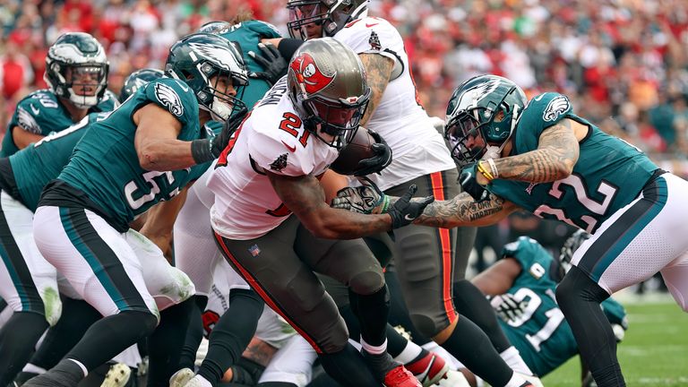 Tampa Bay Buccaneers running back Ke&#39;Shawn Vaughn (21) rushes past Philadelphia Eagles free safety Marcus Epps (22) to score on a 1-yard touchdown run during the first half of an NFL wild-card football game Sunday, Jan. 16, 2022, in Tampa, Fla. 
