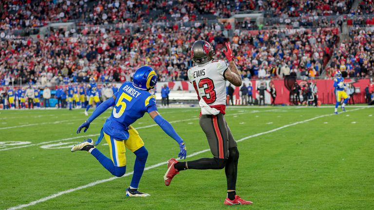 Tampa Bay Buccaneers wide receiver Mike Evans (13) makes a catch for a touchdown in front of Los Angeles Rams cornerback Jalen Ramsey (5) during a NFL divisional playoff football game, Sunday, January 23, 2022 in Tampa, Fla. 